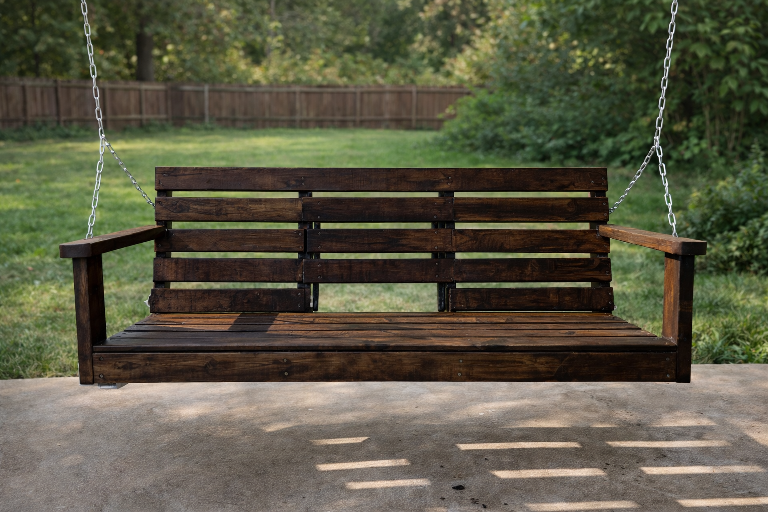 Dark stained porch swing